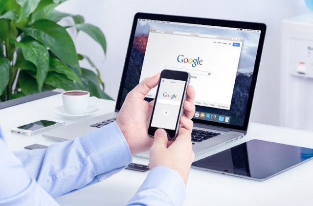 Google search on Apple iPhone screen and Macbook Pro display mul